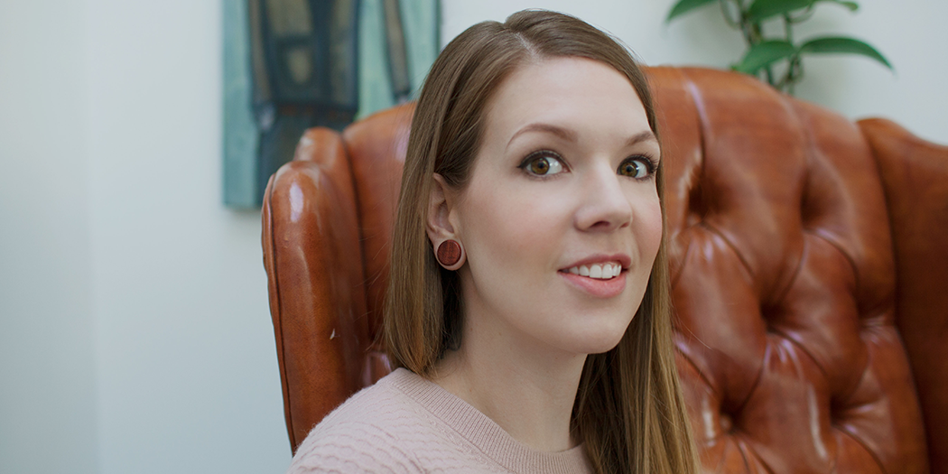 Female wearing Bloodwood ear gauges. 