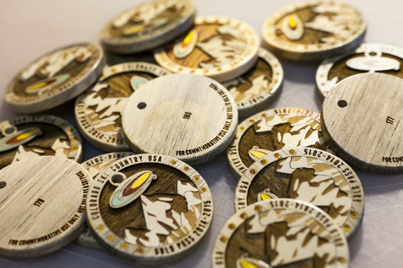Custom wood award medallions with multi wood inlays. 
