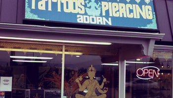 Adorn tattoo and piercing studio storefront. 