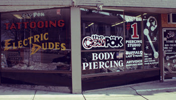 Cowpok tattoo and piercing store front. 