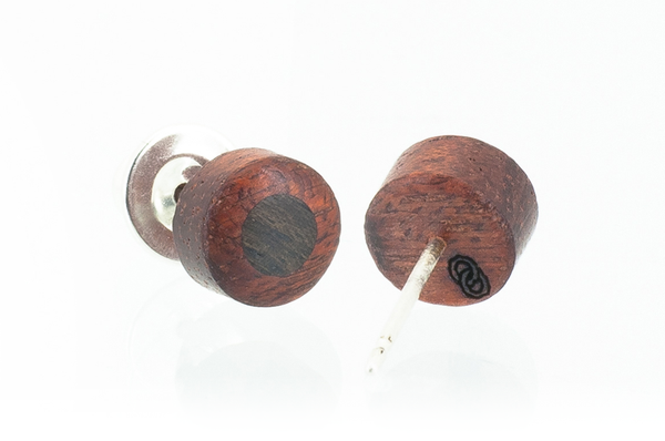 Wood round shaped earrings. Made in Bloodwood. View of logo on back. 