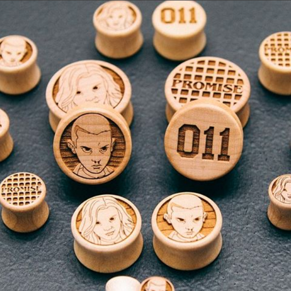 Ear gauge plugs made in Maple wood with Promise Waffle and 011 etched graphics. 