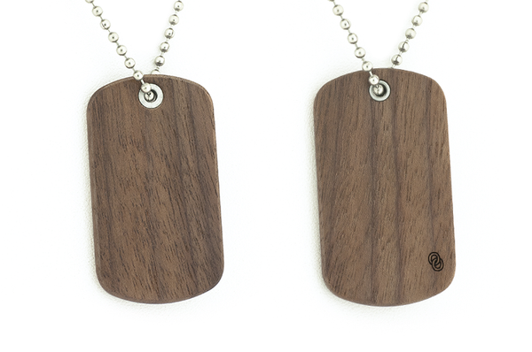 Front and back view of Walnut wood dog tags.