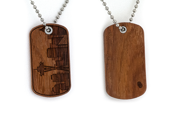 Front and back view of Seattle skyline Granadillo wood dog tag, Seattle Jewelry.